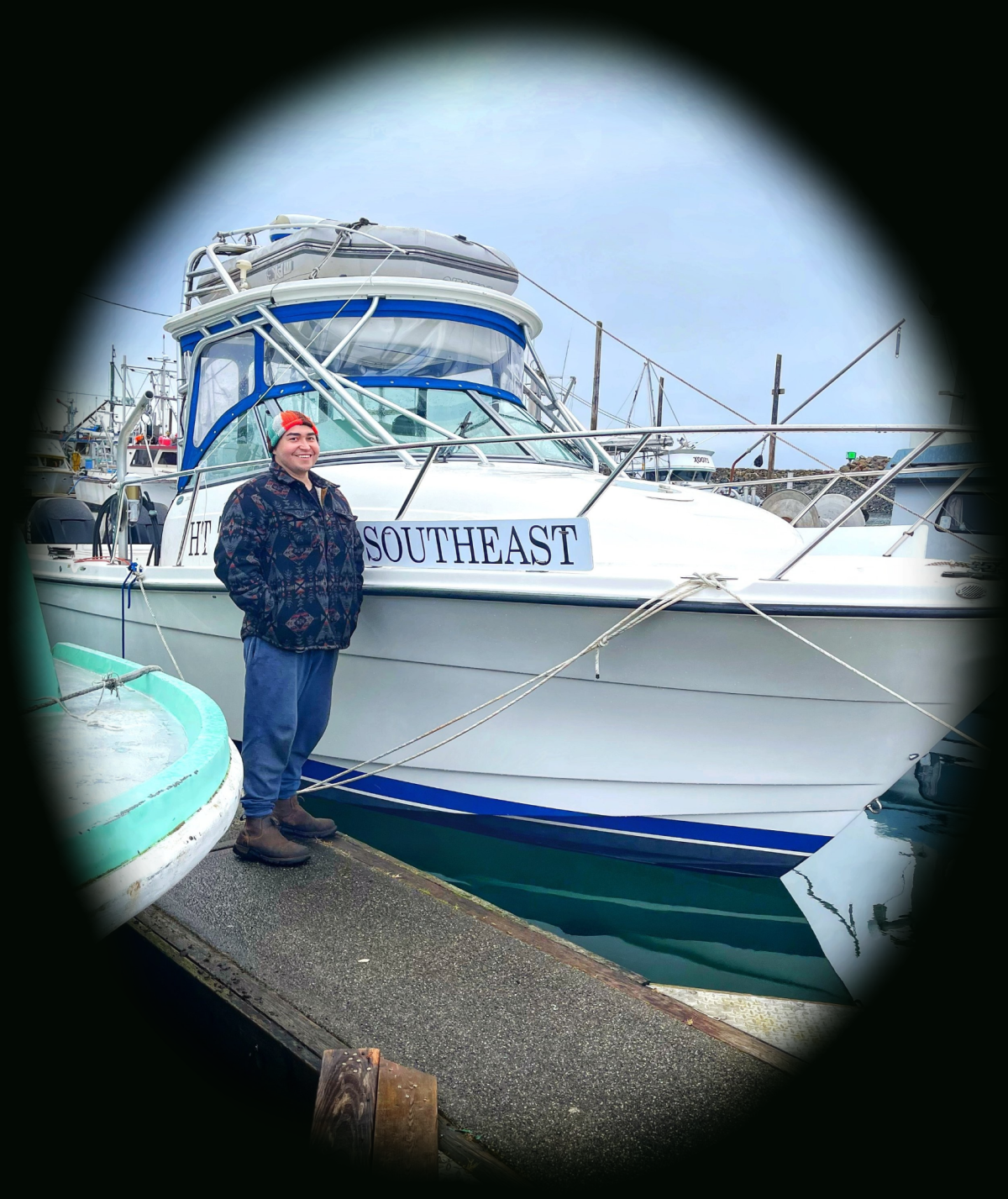 a man standing on a boat in the water